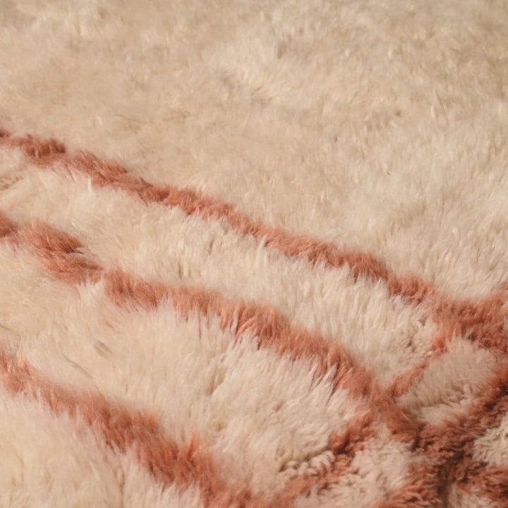 Close-up of custom Beni Mrirt rug, showcasing handwoven wool with a framed grid pattern, ideal Moroccan style for modern spaces.