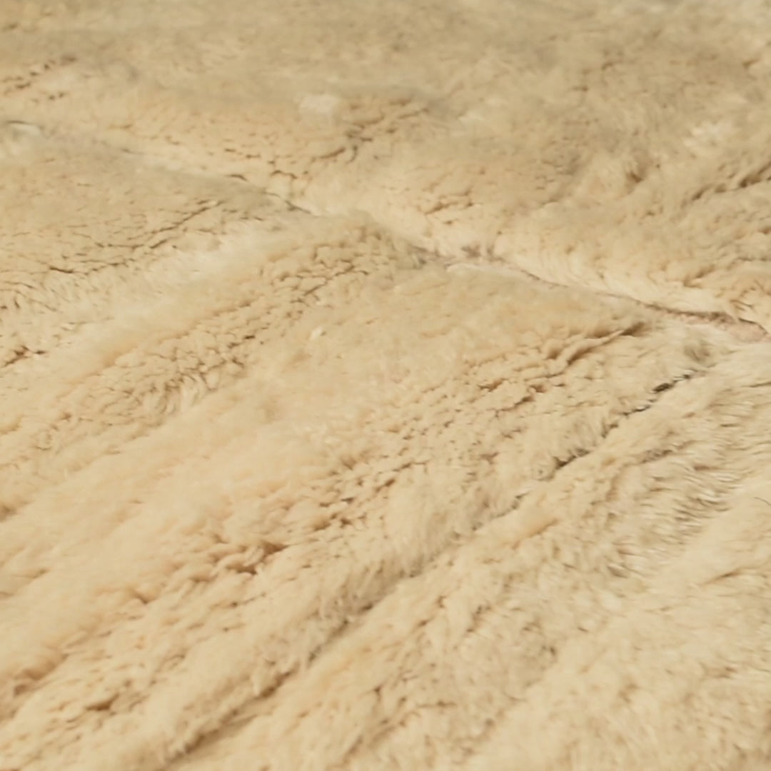 Close-up of Minimalist Cream Beni Mrirt Rug showing plush Moroccan wool texture and organic patterning.
