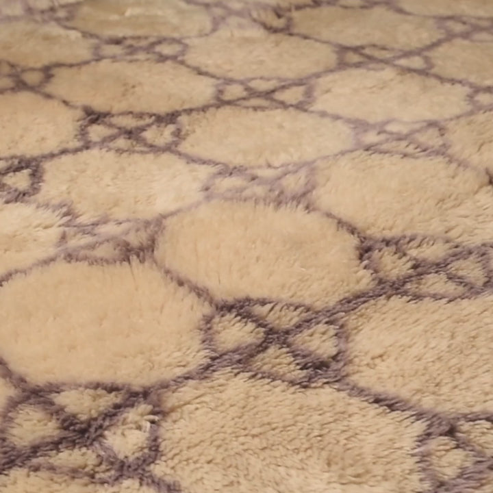 Soft Beni Ourain rug with lavender diamond circles, handmade Moroccan wool, perfect for boho decor, earthy palettes, and cozy living rooms.
