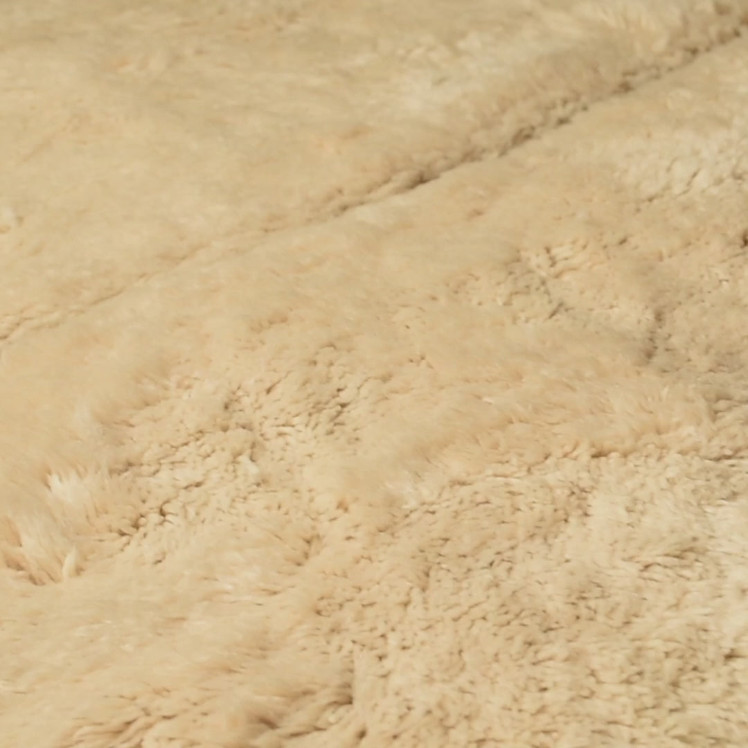 Neutral Beni Mrirt Moroccan wool rug with hand-carved triangle motifs, ideal for calm and minimalist interiors. Creamy ivory pile.