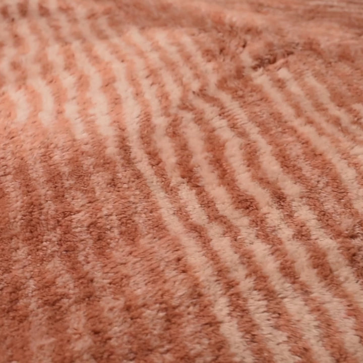 Close-up of Terracotta Chevron Moroccan Wool Rug with hand-carved chevron pattern, featuring rich earthy tones and soft texture.