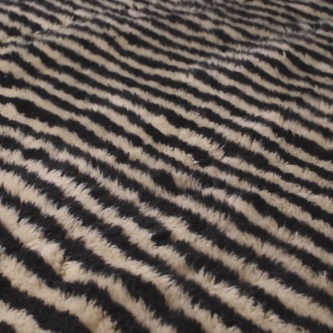 Black and ivory stripe Moroccan wool rug with dynamic design, perfect for modern interiors. Available for sale on Etsy. Ideal as Moroccan runner rug.