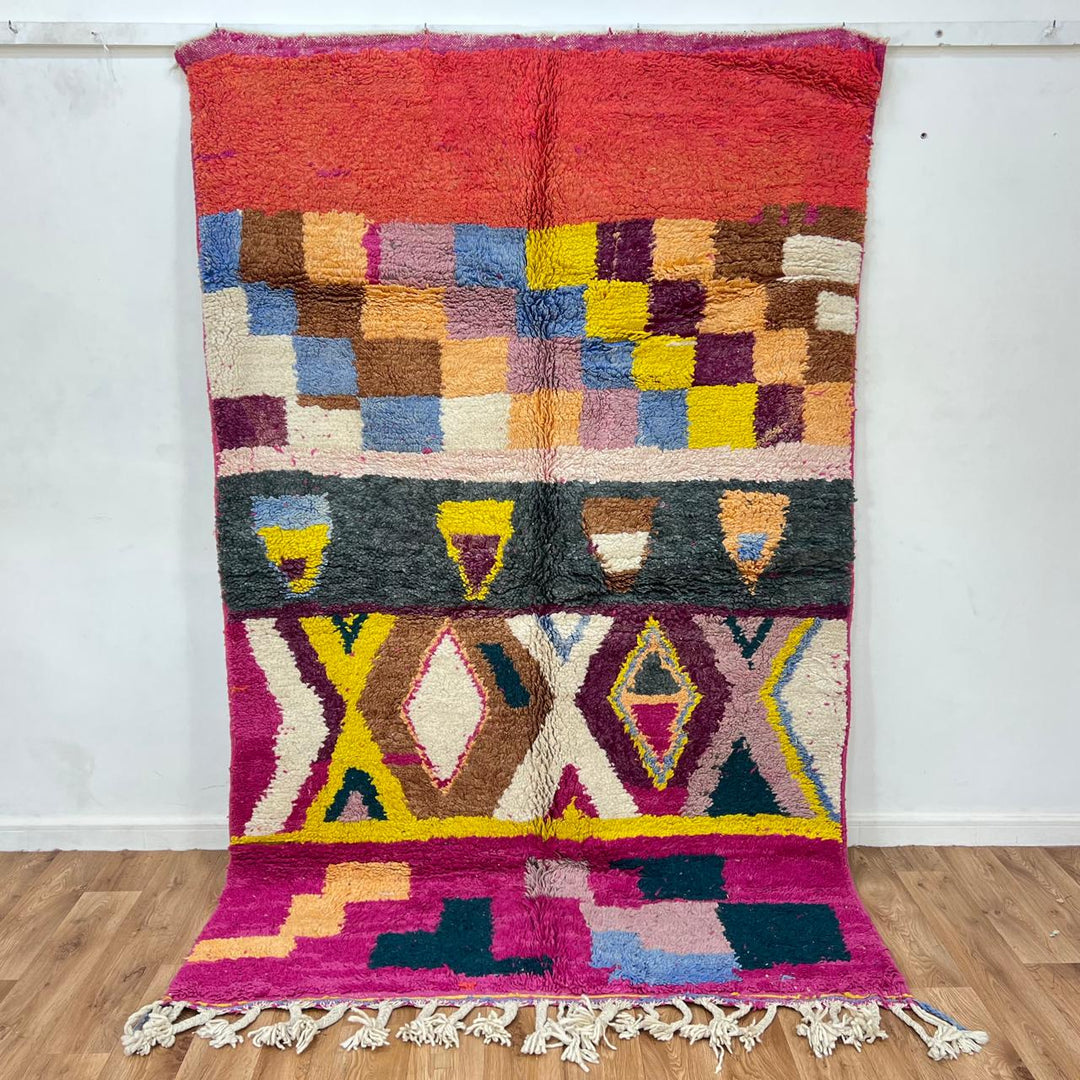 Vintage Moroccan wool rug 791 – handmade colorful geometric Berber wool carpet in pink, yellow, and beige, 247 × 156 cm (8.1 × 5.1 ft).