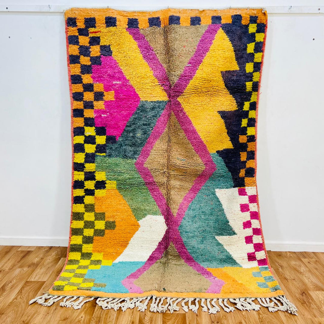 Vintage Moroccan wool rug 596 – handmade colorful geometric rug with pink, yellow, green, and blue patterns, 247 × 163 cm (8.1 × 5.35 ft).