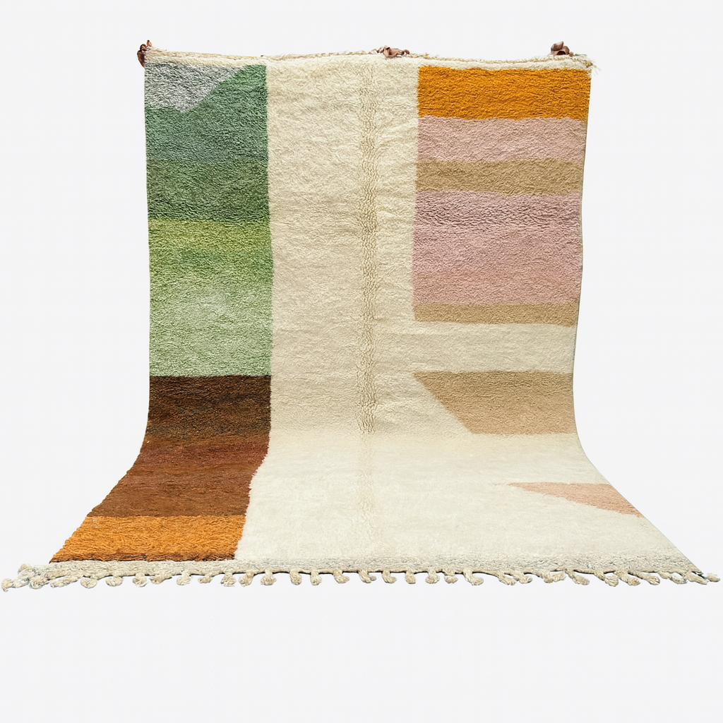 Multicolored geometric patterned rug with tassels on a white background