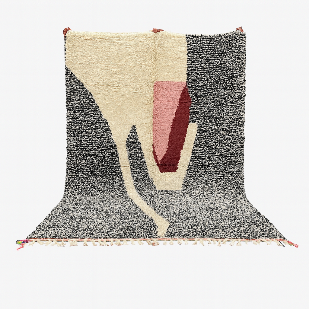 Textured rug with geometric design on a white background