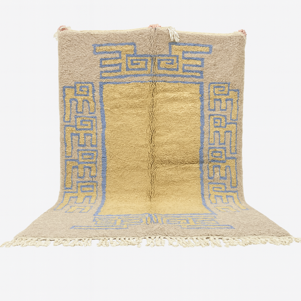 Beige rug with blue geometric patterns on a white background