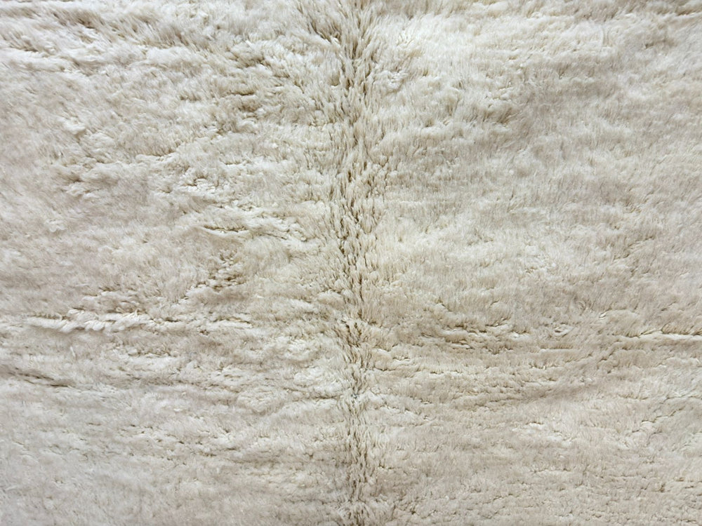 Close-up of a textured beige fabric surface