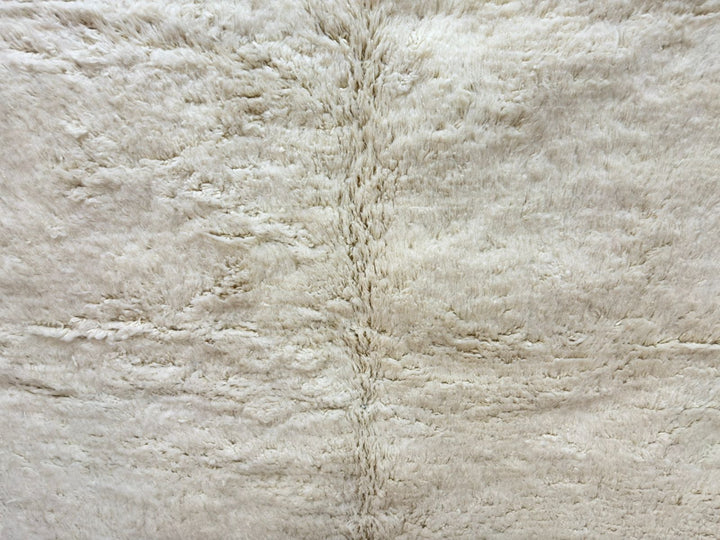 Close-up of a textured beige fabric surface