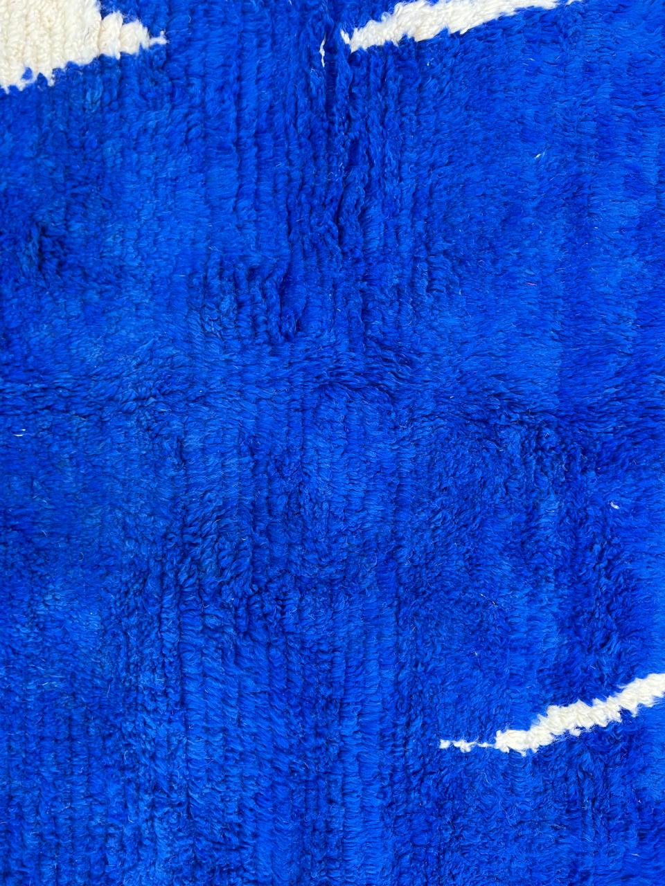 blue moroccan wool rug with minimal berber abstract line pattern handmade