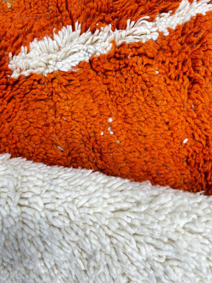 Handmade colorful abstract Moroccan wool runner rug with blue, orange, green, mustard, and cream geometric shapes.