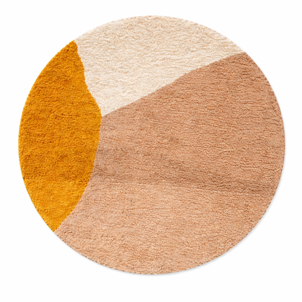 Abstract earth tone round Moroccan wool rug with mustard, ivory, and clay color-block design, handmade plush Berber shag area rug