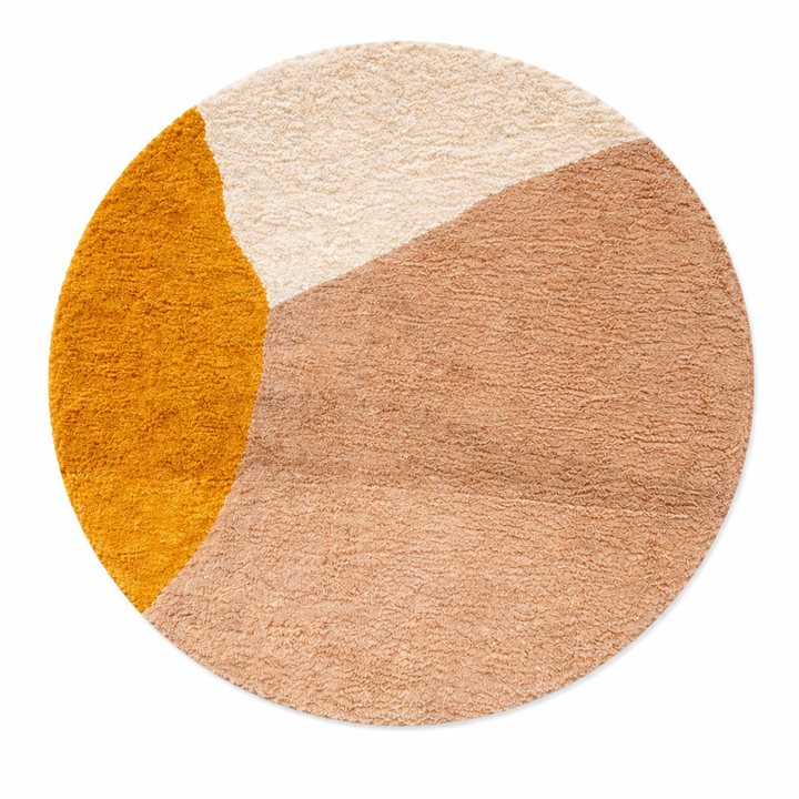 Abstract earth tone round Moroccan wool rug with mustard, ivory, and clay color-block design, handmade plush Berber shag area rug