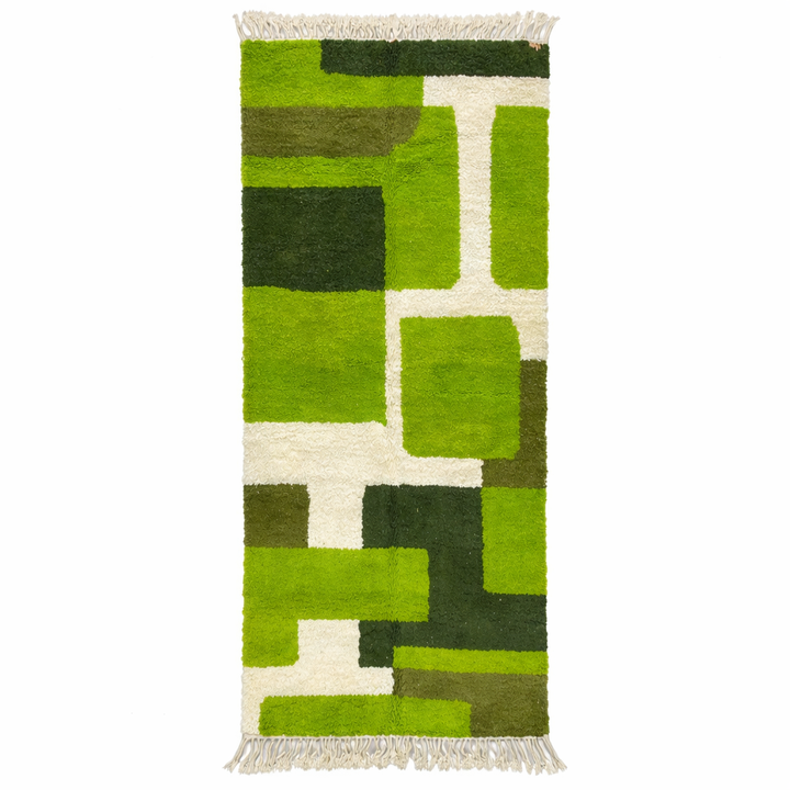 Green abstract Moroccan runner rug with geometric color block design, handmade from wool by Berber artisans.