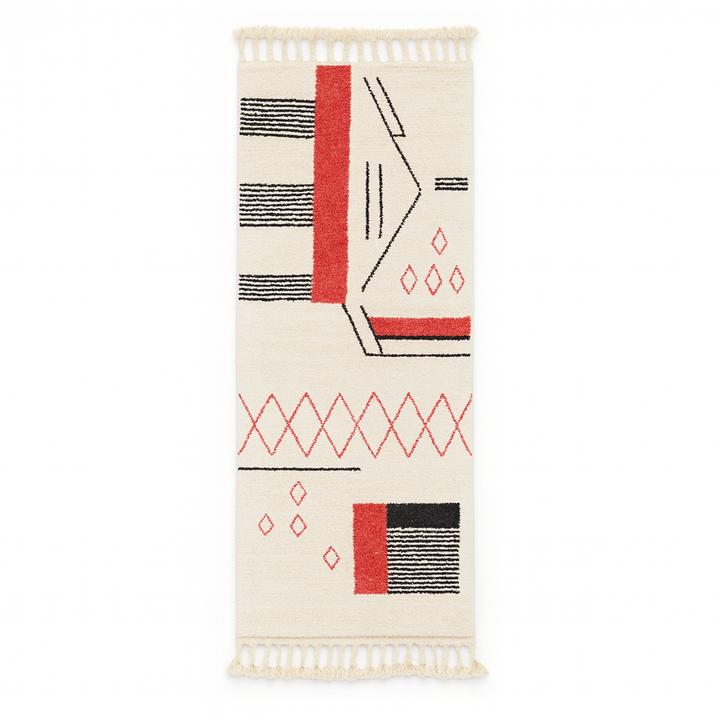 Handmade white Moroccan runner rug with red and black abstract geometric patterns in natural wool.