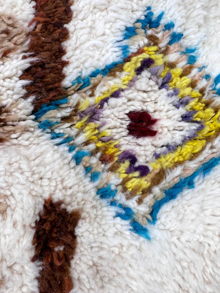 Modern Moroccan wool rug with earth tones and floating diamond pattern