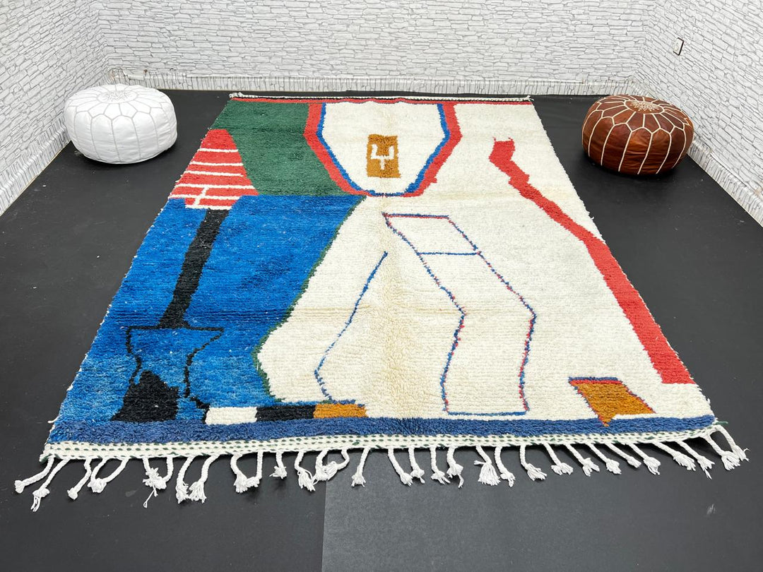 Abstract handmade Moroccan wool rug in green, red, blue, brown, and cream – geometric Berber design