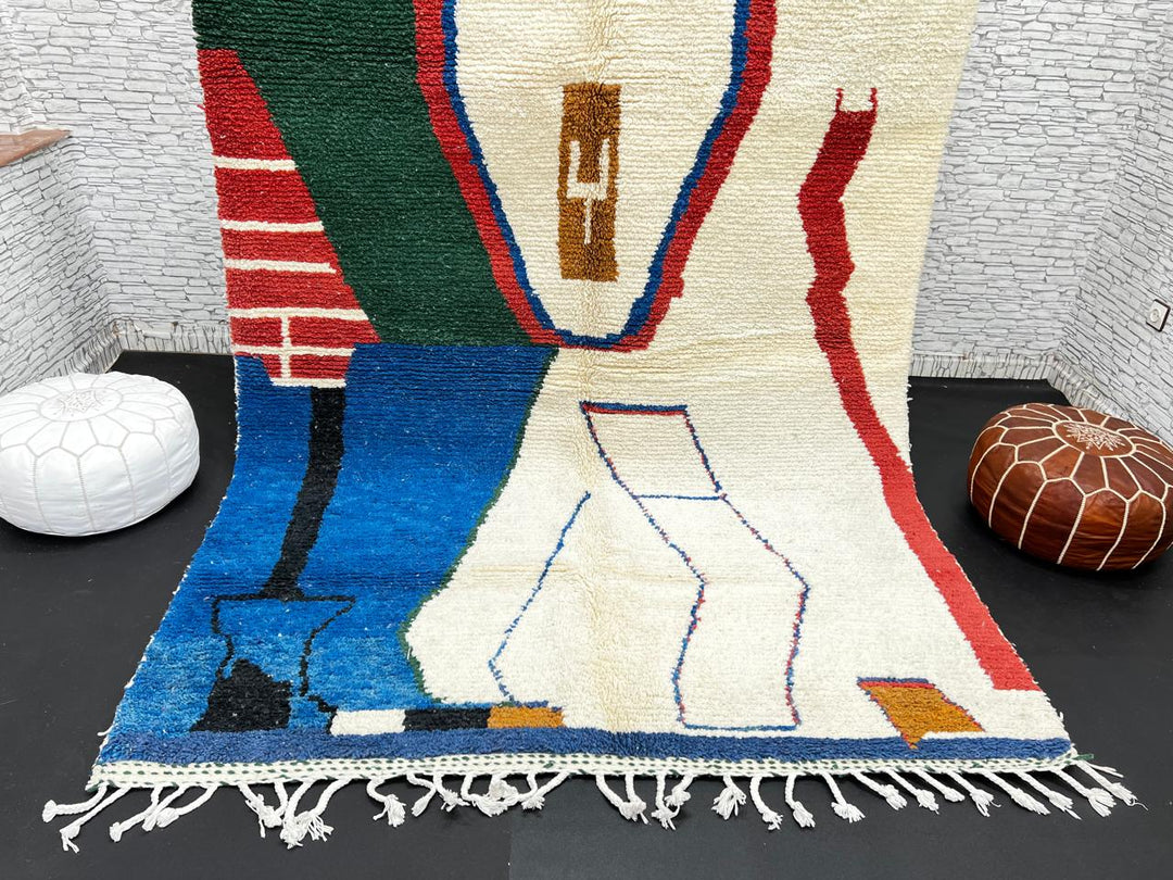 Abstract handmade Moroccan wool rug in green, red, blue, brown, and cream – geometric Berber design