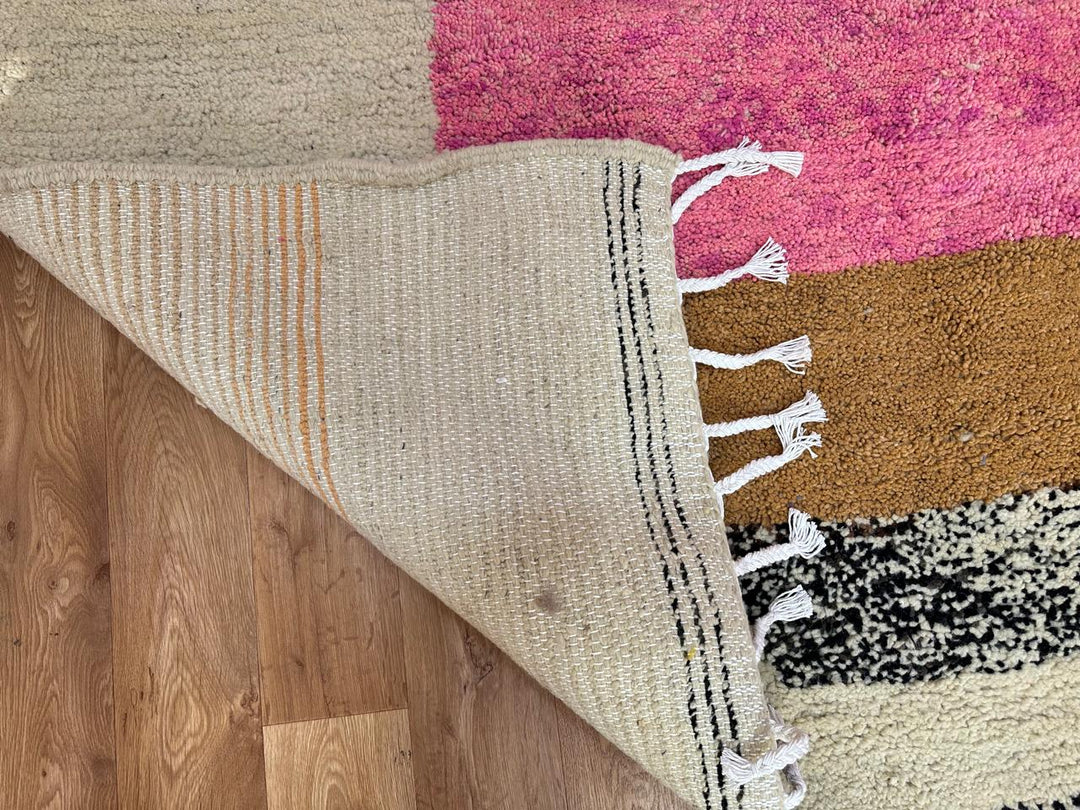 Artistic Moroccan wool runner rug with abstract Berber design and pink center