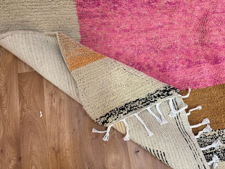 Artistic Moroccan wool runner rug with abstract Berber design and pink center