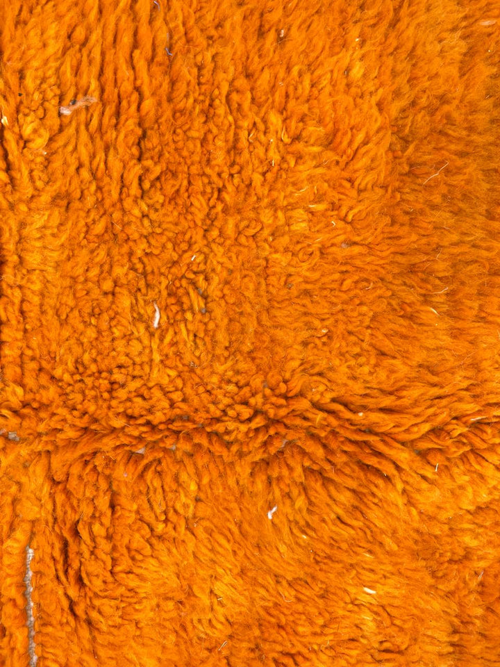 Handwoven abstract Moroccan wool rug with orange, red, and cream geometric design