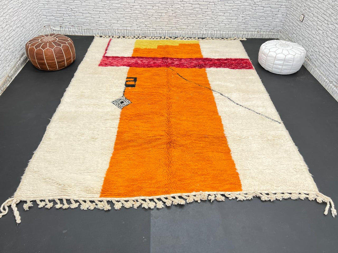 Handwoven abstract Moroccan wool rug with orange, red, and cream geometric design