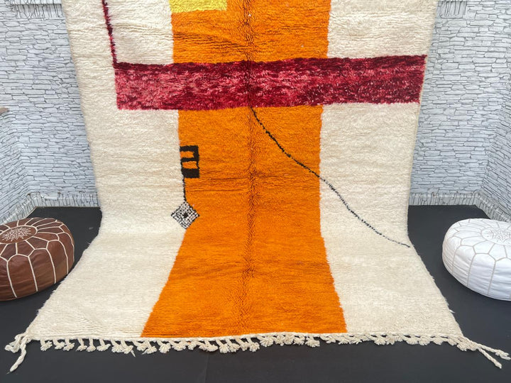 Handwoven abstract Moroccan wool rug with orange, red, and cream geometric design