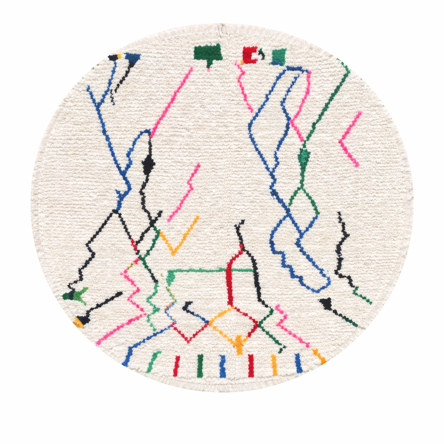 Round handmade Moroccan Berber rug with ivory wool base and colorful abstract lines in blue, green, pink, black and red.