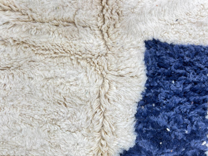 Abstract handmade Moroccan runner rug in white wool with navy blue and orange geometric shapes