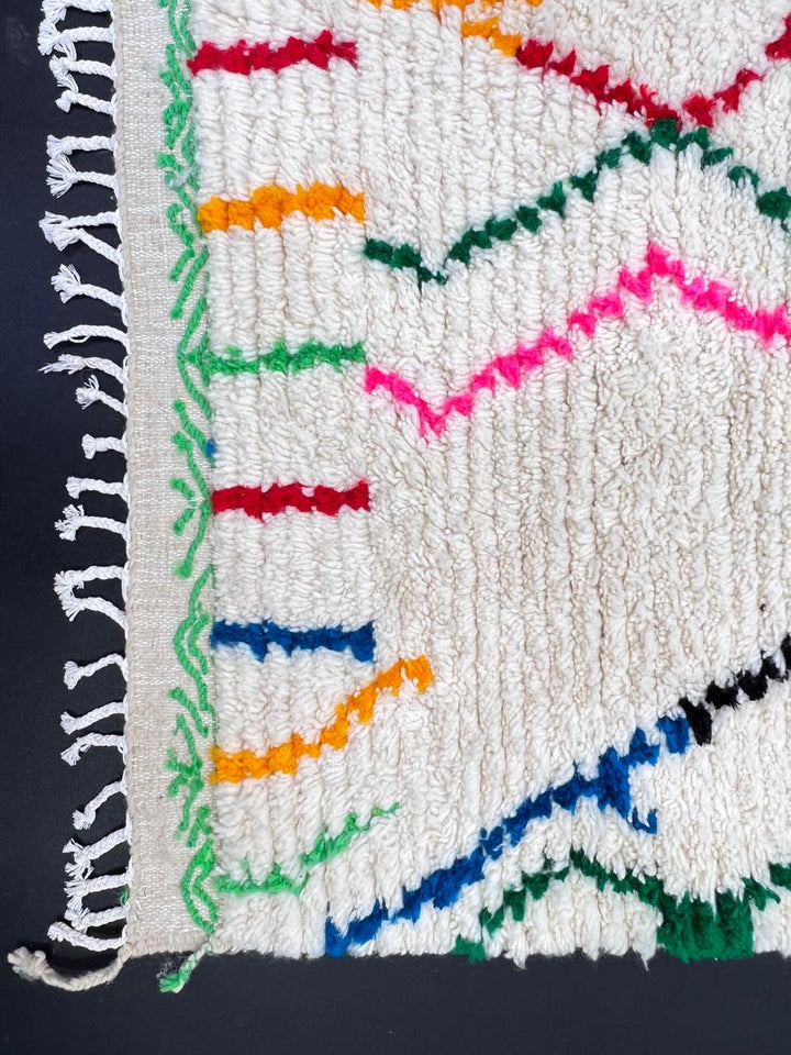 Handwoven abstract Moroccan wool runner rug with multicolor Berber lines on ivory background