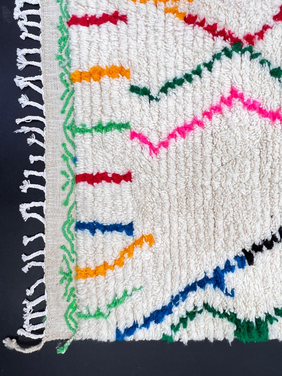 Handwoven abstract Moroccan wool runner rug with multicolor Berber lines on ivory background