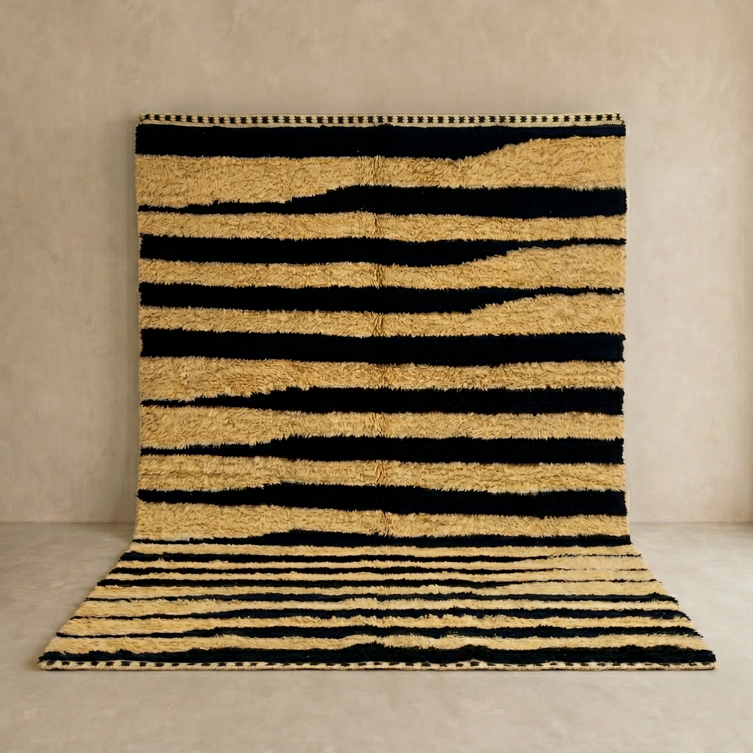 Abstract Moroccan wool rug in beige with black line pattern, handwoven by Berber artisans. Perfect as a contemporary area rug.