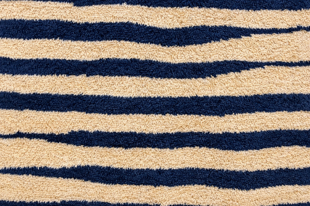 Abstract Moroccan wool rug in beige with black line pattern, handwoven by Berber artisans. Perfect as a contemporary area rug.