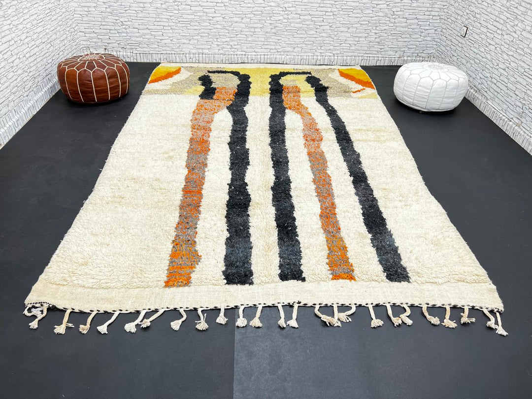 Handmade ivory Moroccan wool rug with orange, black, yellow, and gray abstract stripe patterns – modern Berber rug