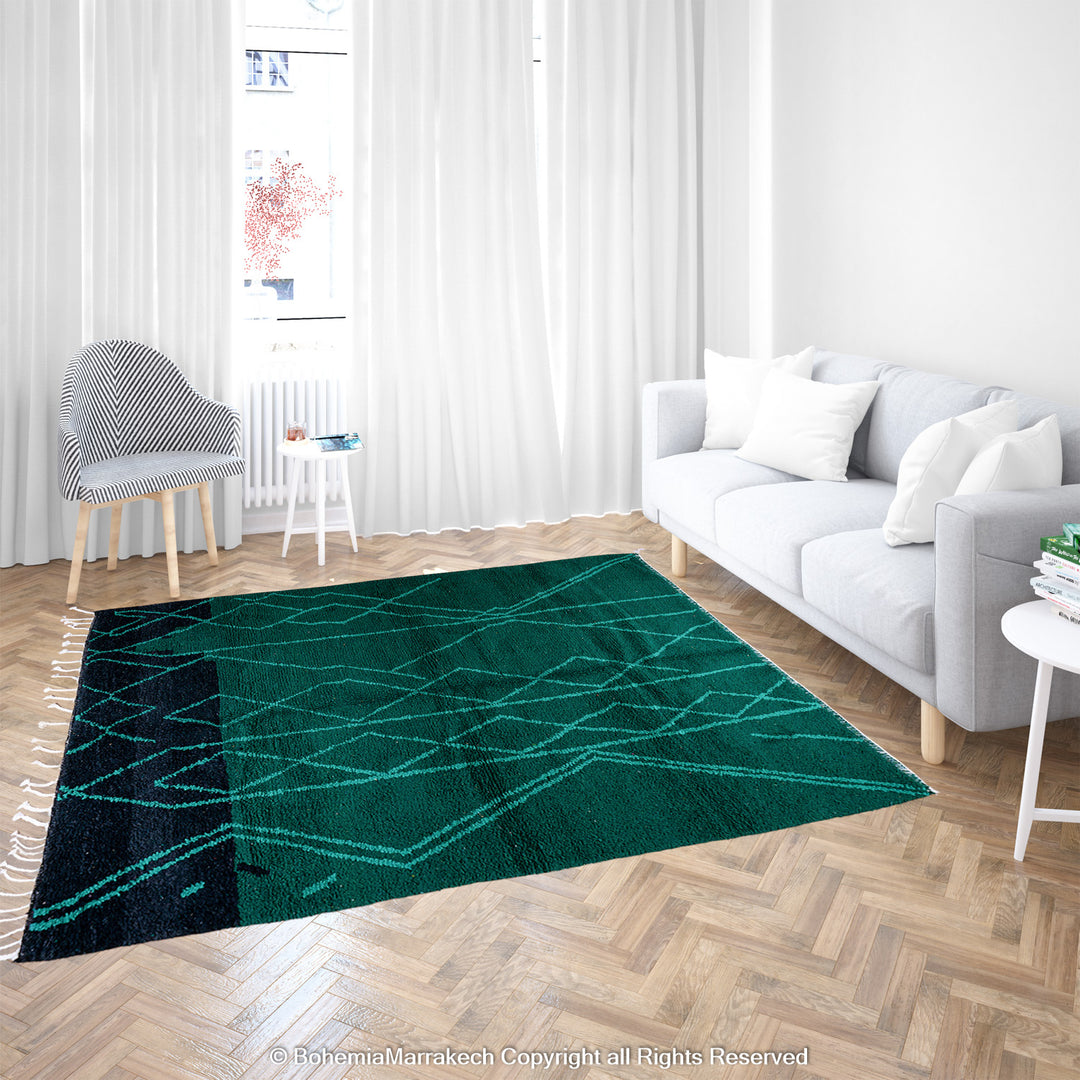 Green Moroccan Boujaad rug with black Berber motifs, handmade in wool by artisans in Morocco