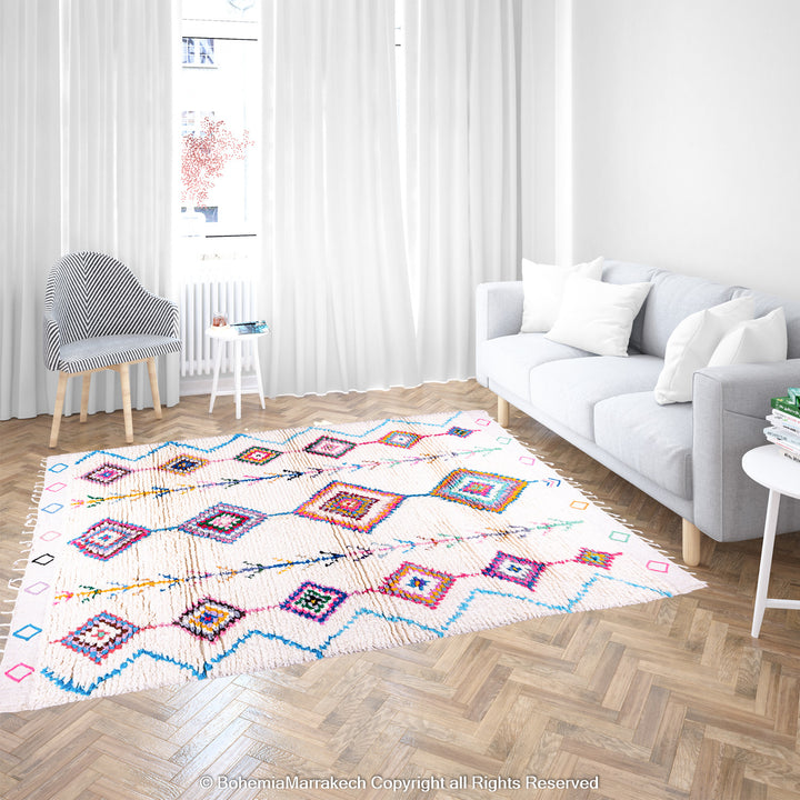 Colorful handmade Boujaad Moroccan rug with traditional Berber diamond patterns on a cream wool background