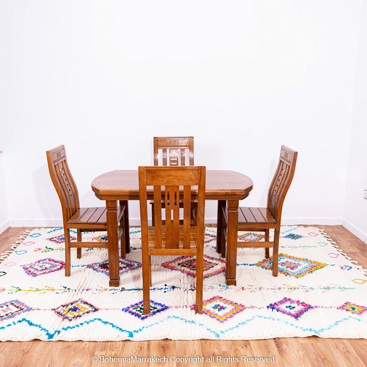 Colorful handmade Boujaad Moroccan rug with traditional Berber diamond patterns on a cream wool background