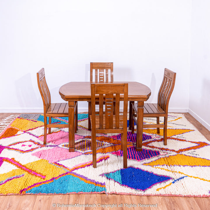 Multicolored Moroccan Boujaad Rug handmade with wool, featuring vibrant pink, yellow, and blue Berber patterns.