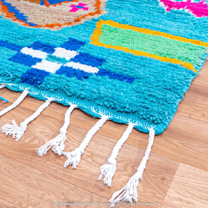 Blue Moroccan Boujaad rug with bold multicolor geometric Berber patterns, handmade in wool