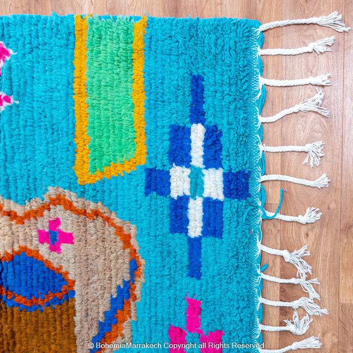 Blue Moroccan Boujaad rug with bold multicolor geometric Berber patterns, handmade in wool