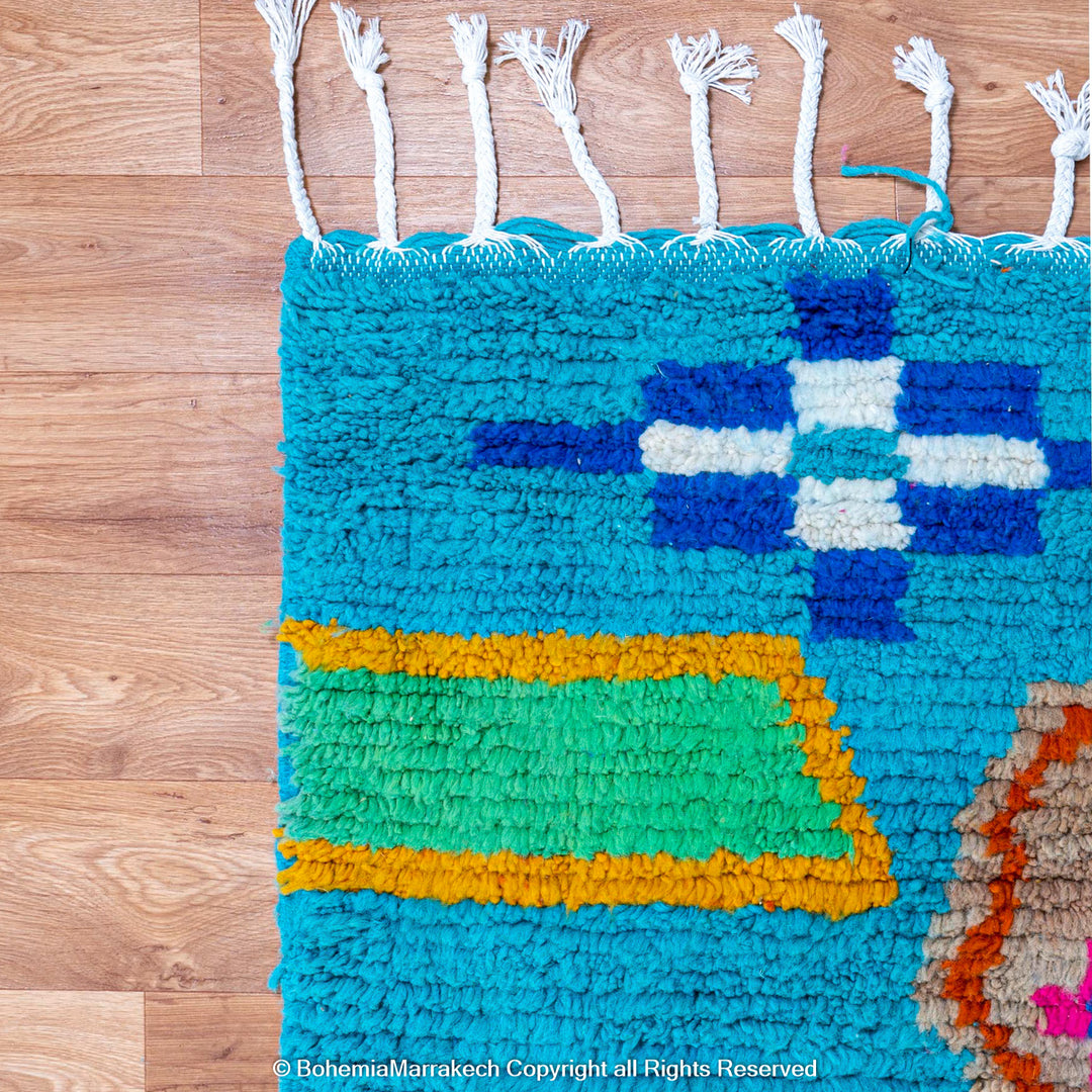 Blue Moroccan Boujaad rug with bold multicolor geometric Berber patterns, handmade in wool