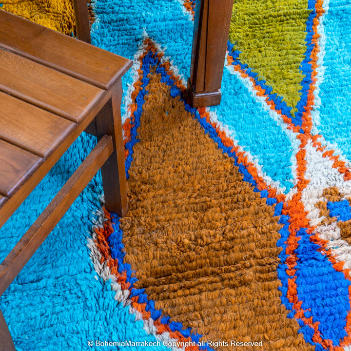 Blue Moroccan Boujaad rug with bold multicolor geometric Berber patterns, handmade in wool