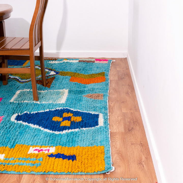 Blue Moroccan Boujaad rug with bold multicolor geometric Berber patterns, handmade in wool