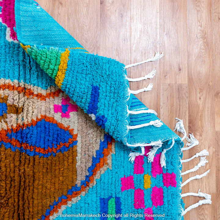 Blue Moroccan Boujaad rug with bold multicolor geometric Berber patterns, handmade in wool