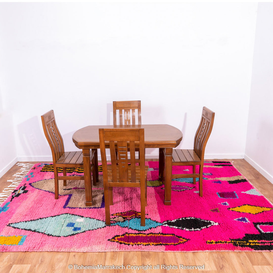Pink Moroccan Boujaad rug with colorful geometric motifs, handmade in soft wool by Berber artisans