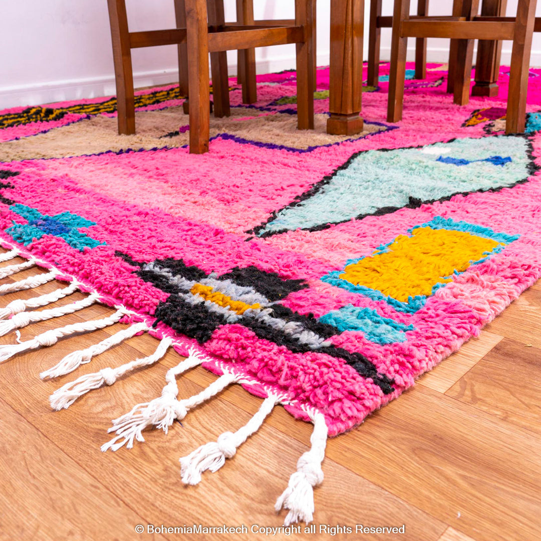Pink Moroccan Boujaad rug with colorful geometric motifs, handmade in soft wool by Berber artisans