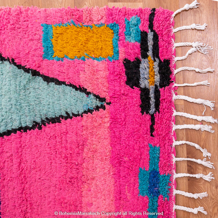 Pink Moroccan Boujaad rug with colorful geometric motifs, handmade in soft wool by Berber artisans