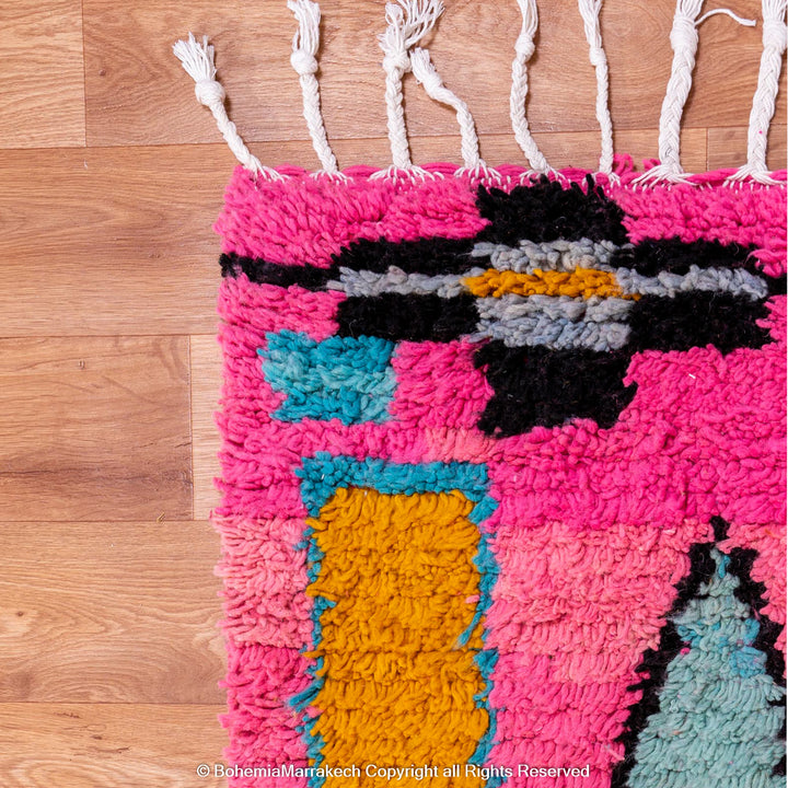 Pink Moroccan Boujaad rug with colorful geometric motifs, handmade in soft wool by Berber artisans