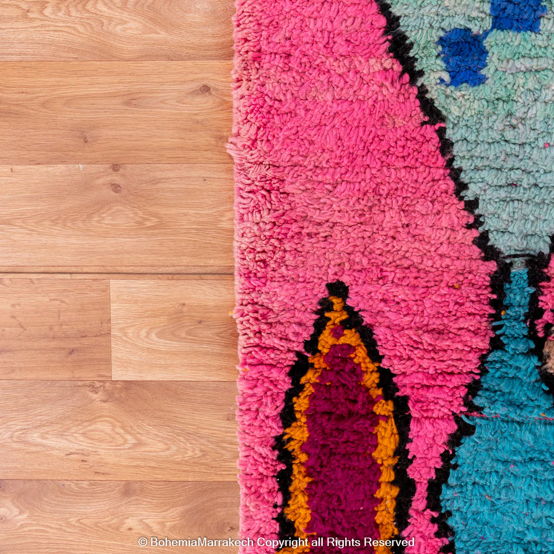 Pink Moroccan Boujaad rug with colorful geometric motifs, handmade in soft wool by Berber artisans