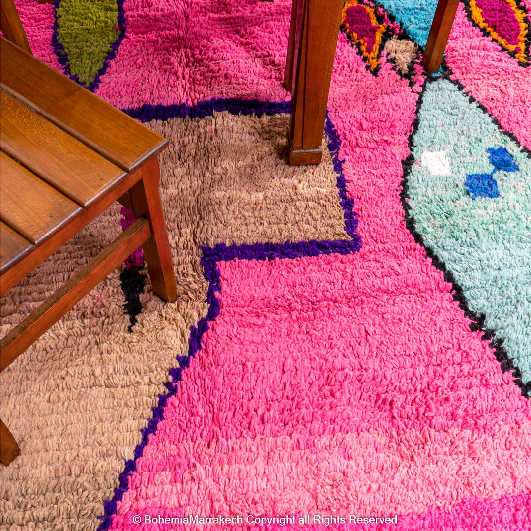 Pink Moroccan Boujaad rug with colorful geometric motifs, handmade in soft wool by Berber artisans